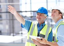 Construction managers discussion a construction project.