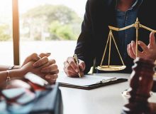 Lawyer and client discussing contract.